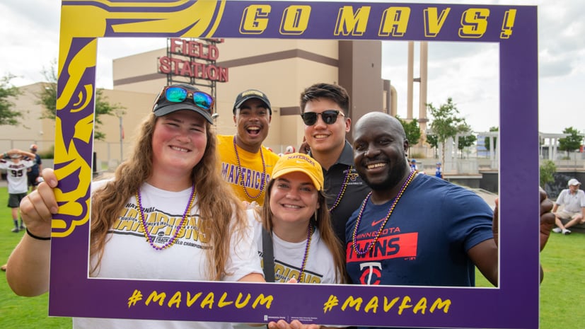 a group of people posing for a photo