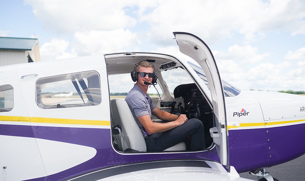 image of student preparing for flight in MSU airplane
