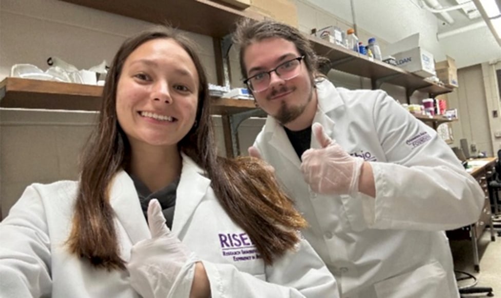 image of two students participating in RISEbio