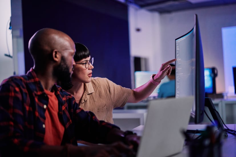 Man and women working on computer.