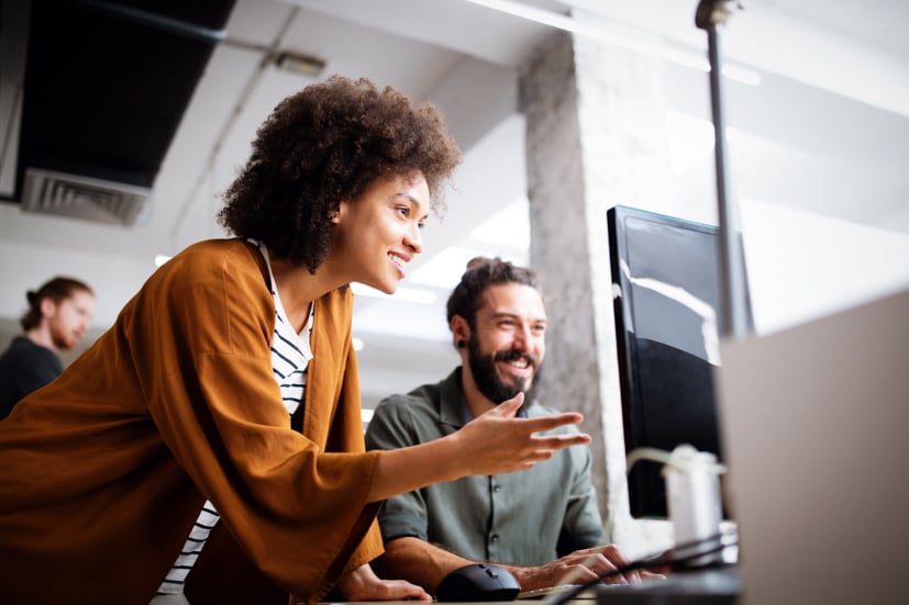 Man and women working on computer.