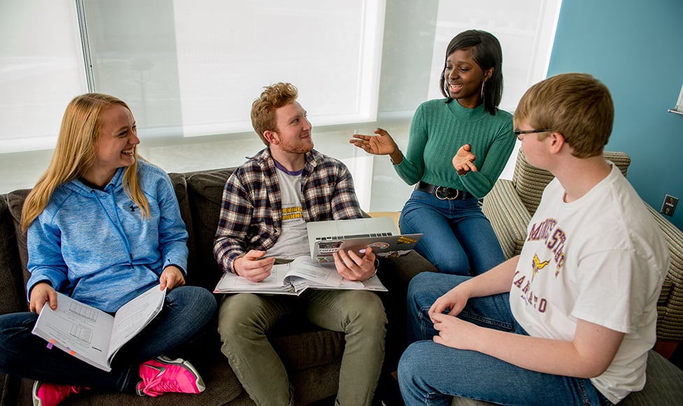group of students discussing the corrections program at MSU