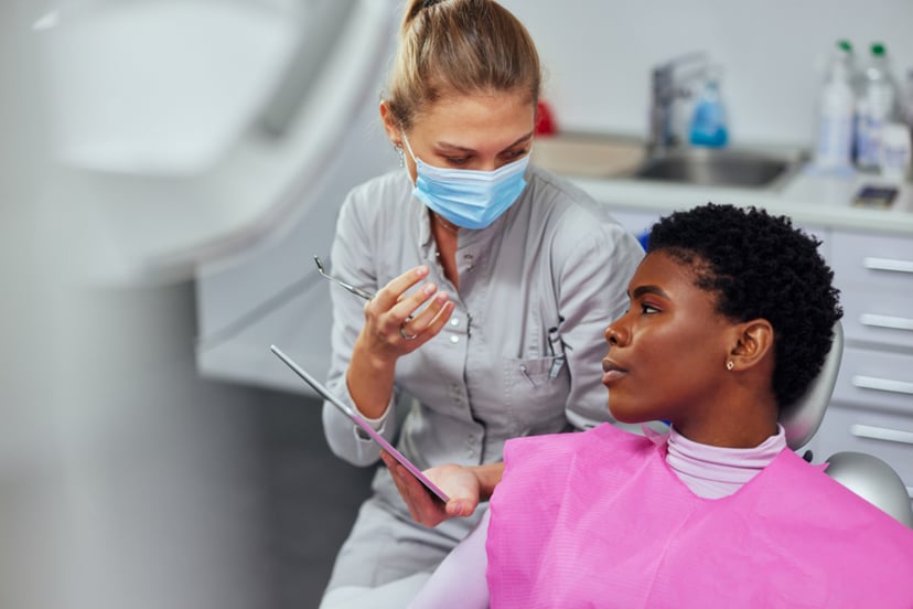 Dental assistant working on patient. 