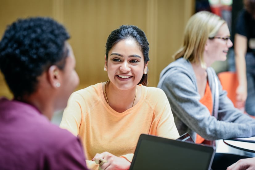 Women smiling.