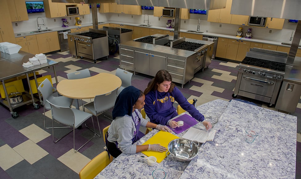 students in the food lab with state of the art equipment and cambria countertops