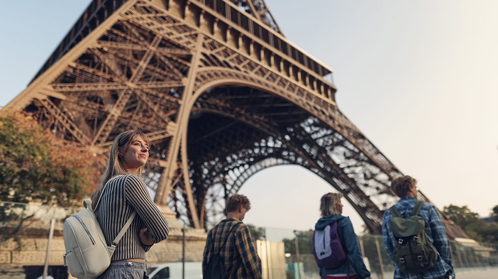 tourists outside of the Eiffel Tower