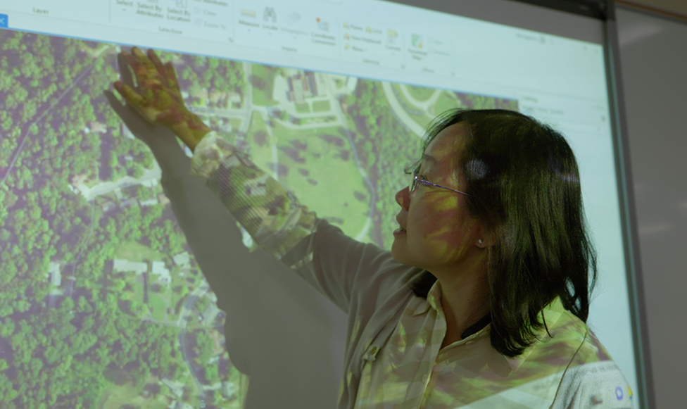Students looking at cartography map on screen