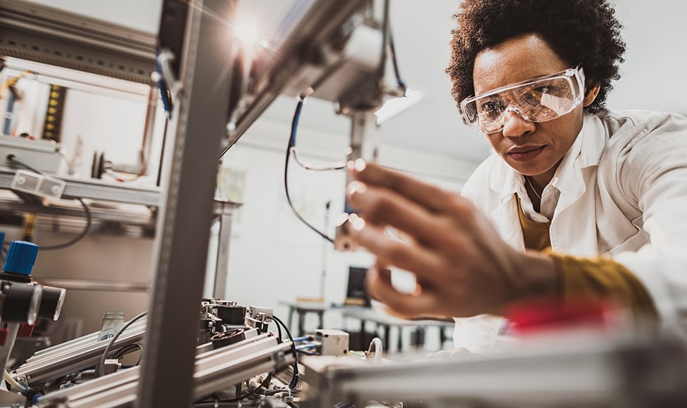 faculty in the lab looking at equipment