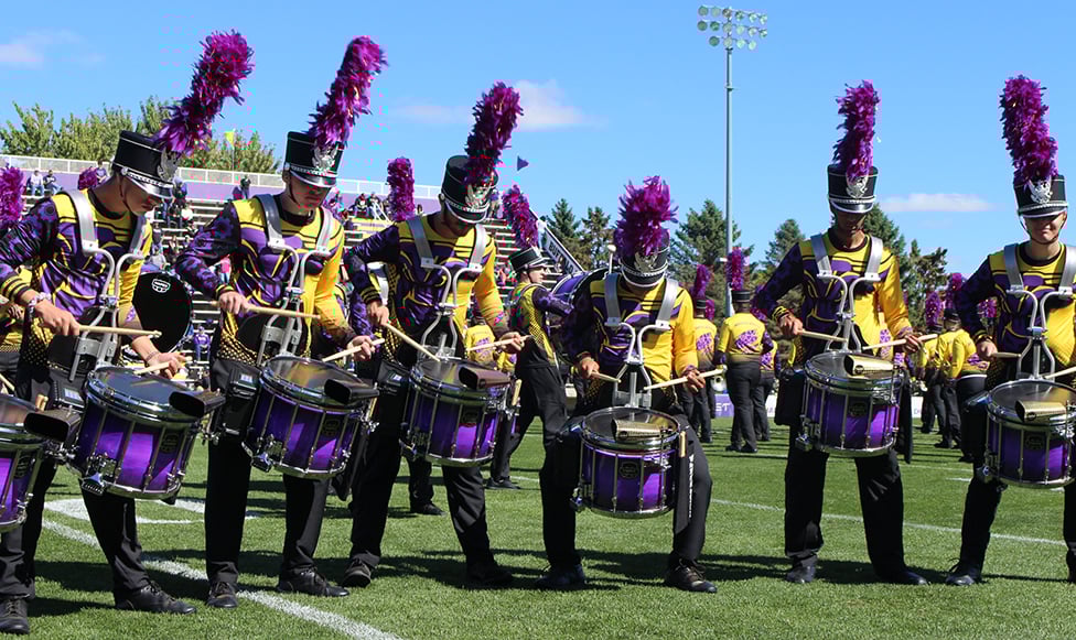Maverick Machine playing their instruments decked out in uniform- view from below