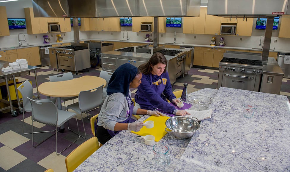 students working on a recipe on the food lab with state of the art equipment and cambria countertops