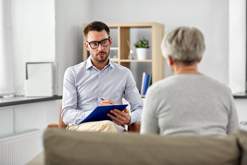 Man therapist having conversation with women. 