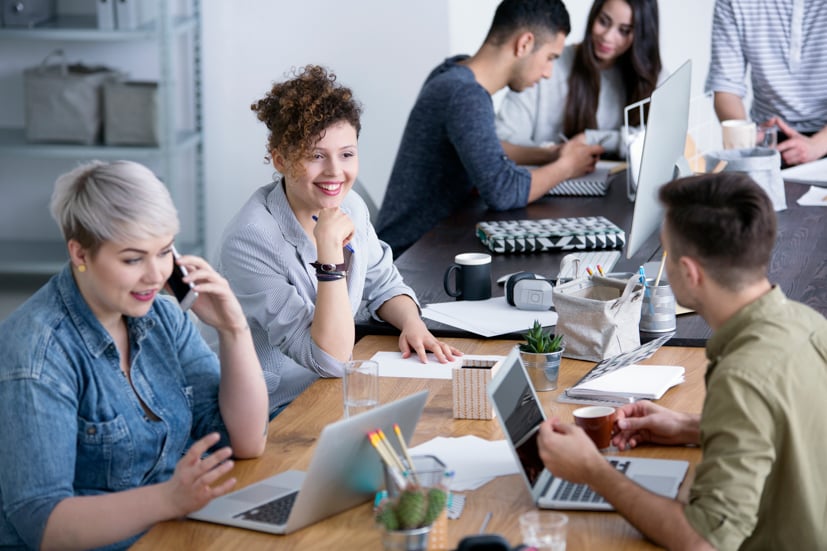Group of students working at a table.