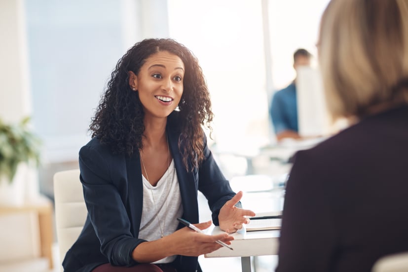 Women talking to another person.