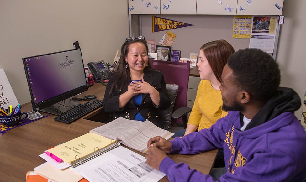 two students in an advising office getting student support