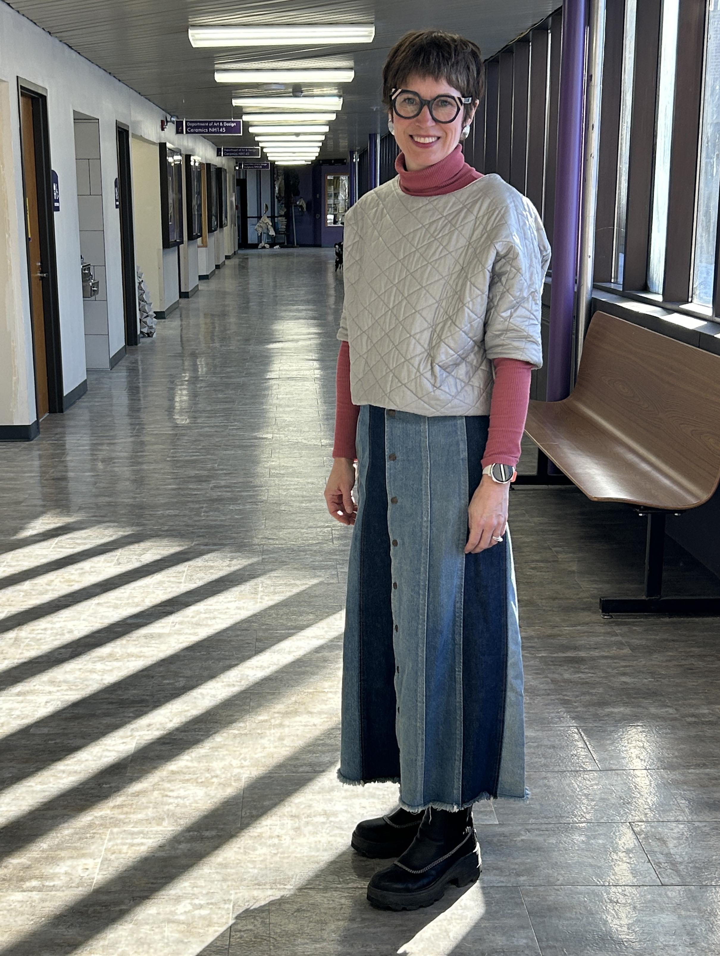 Liz Miller in standing in her academic building near the art gallery