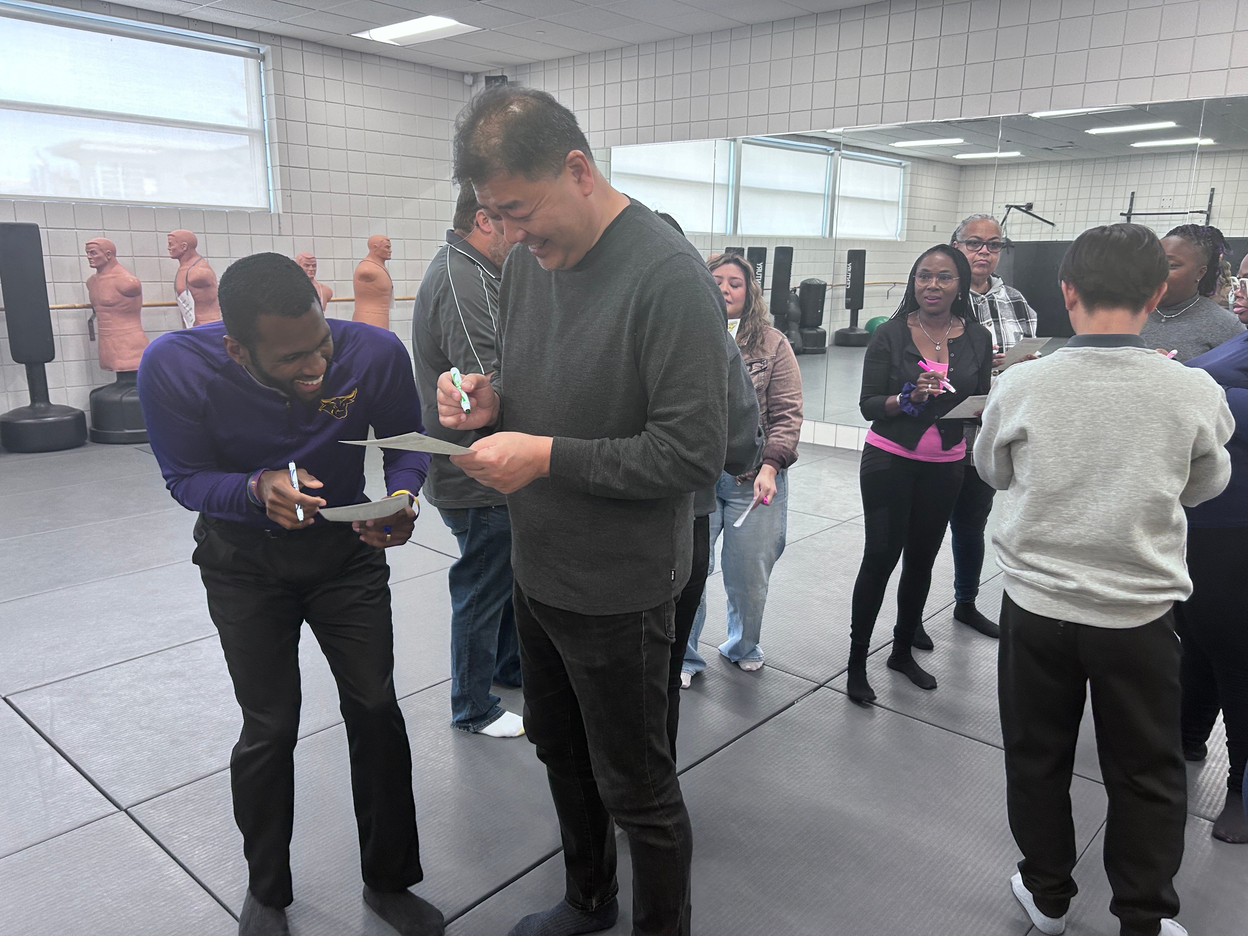 MSU Instructor working with the counselors and laughing