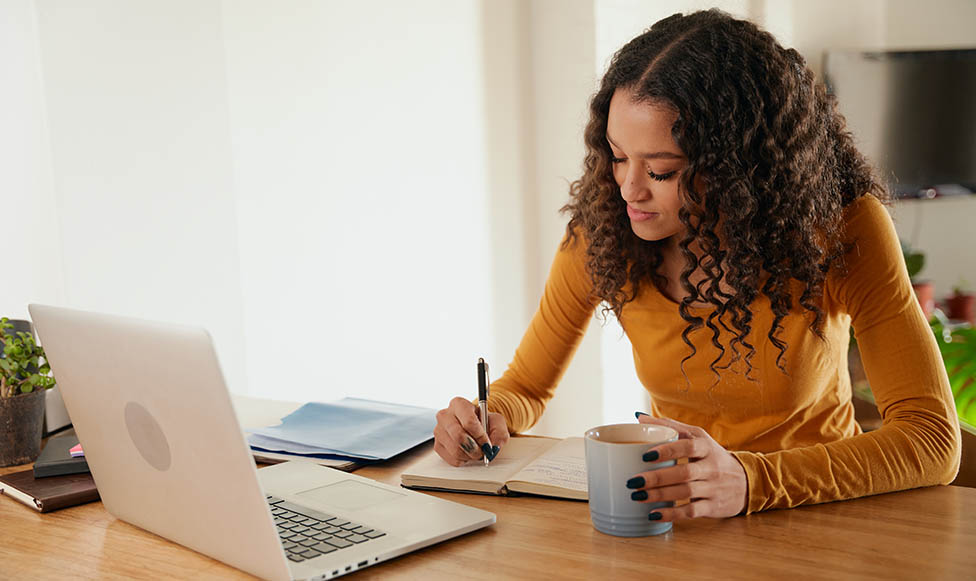 a person writing in a notebook