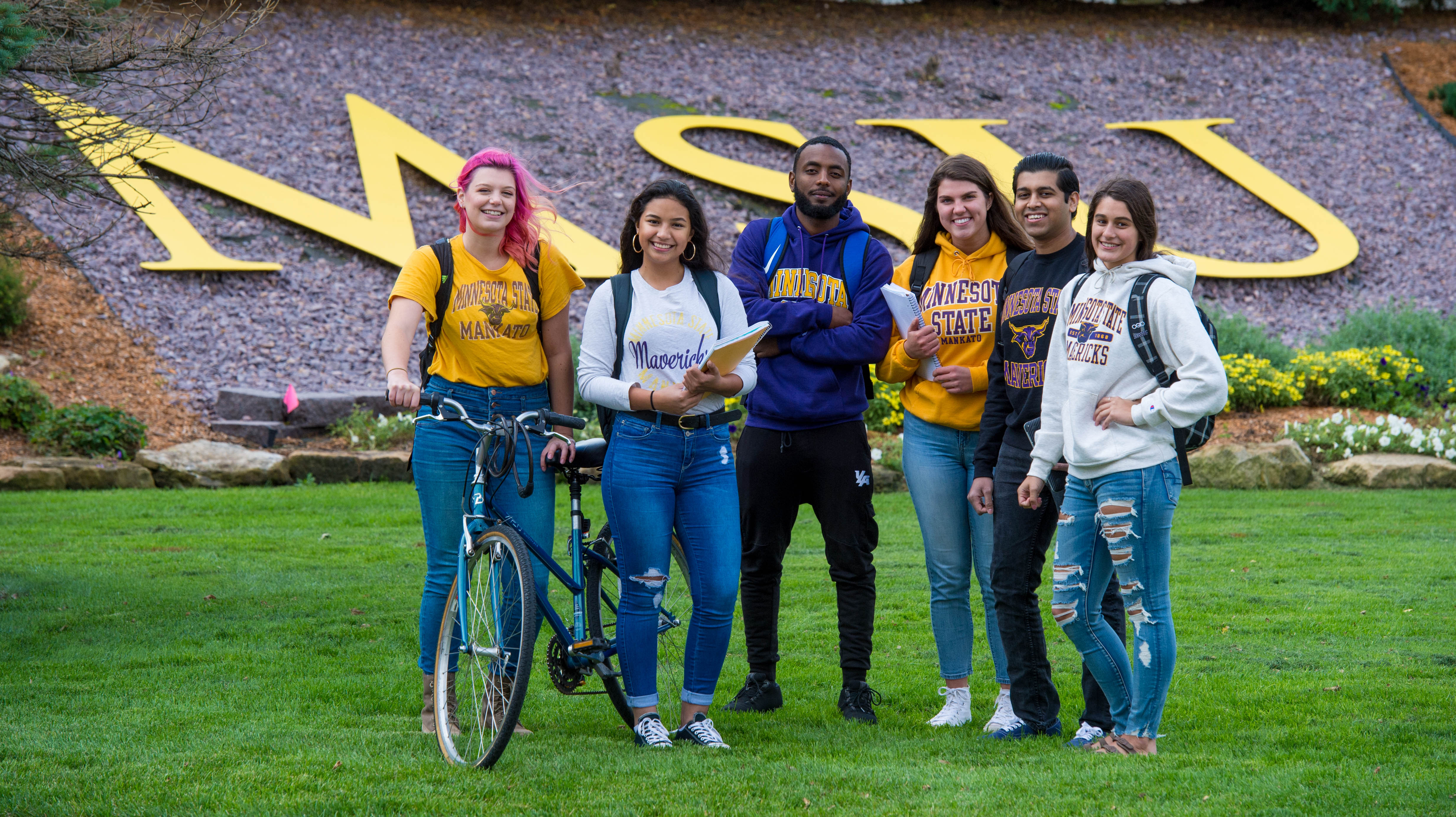 image of MSU students outside near the MSU sign