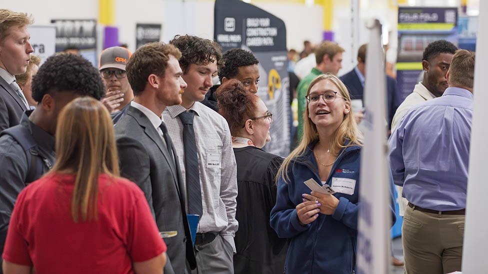 Students meeting with an employer at the Career Expo