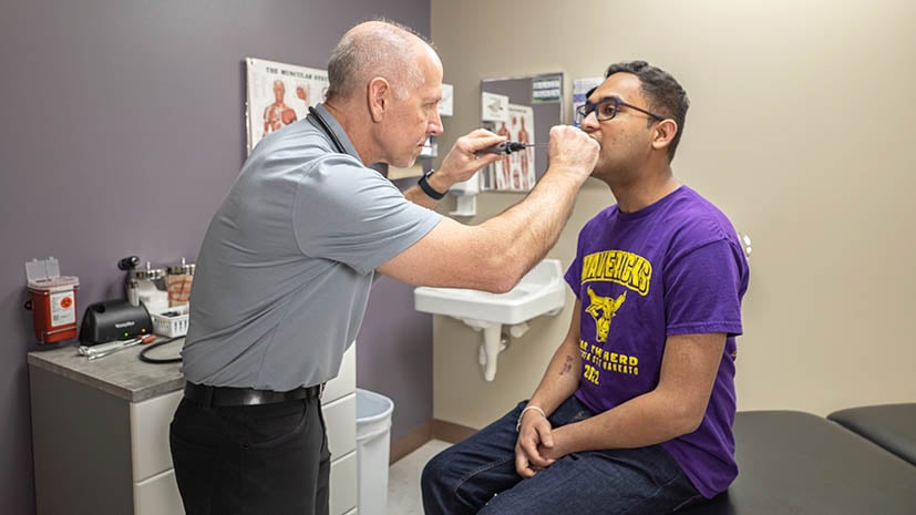 Provider working with patient in a clinic room