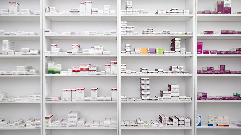 Pharmacy shelves full of medication