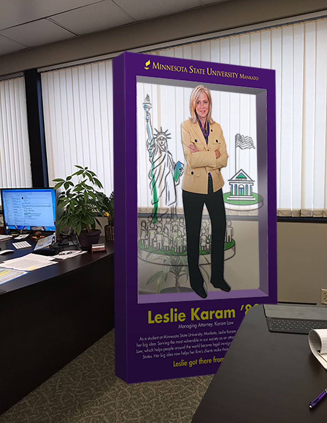 Square cardboard cutout of Leslie Karam, '88 alumni of MNSU 