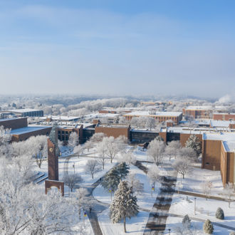 A snowy landscape of Minnesota State University, Mankato buildings and trees