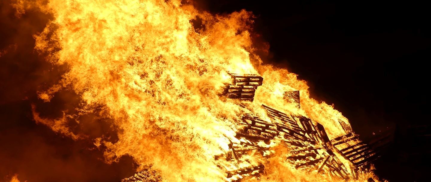 Traditional burning of large bonfire at Minnesota State University Mankato Homecoming