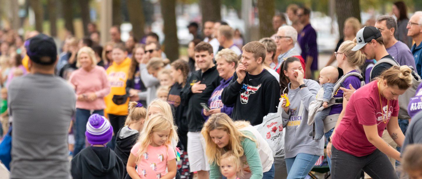 huge crowd gathered together for the homecoming parade