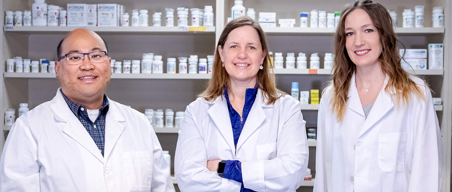 a group of people in lab coats