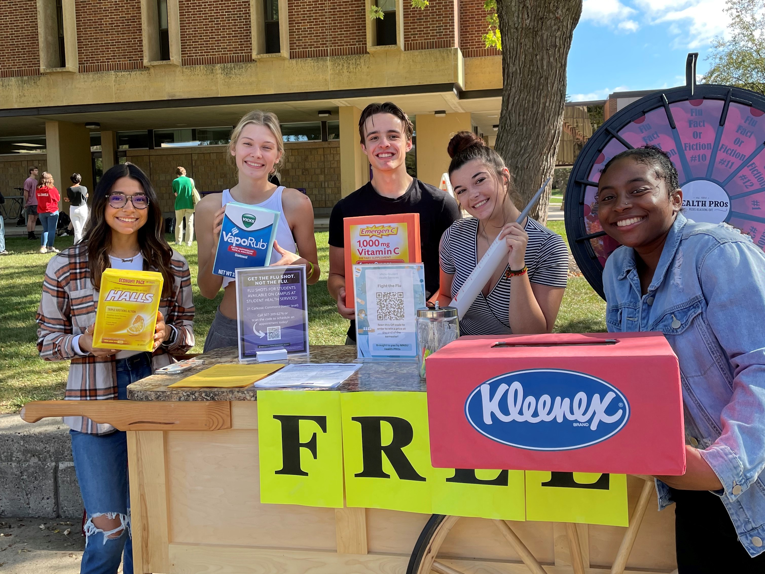 student volunteers promoting flu shots