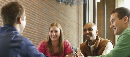 a group of people sitting at a table