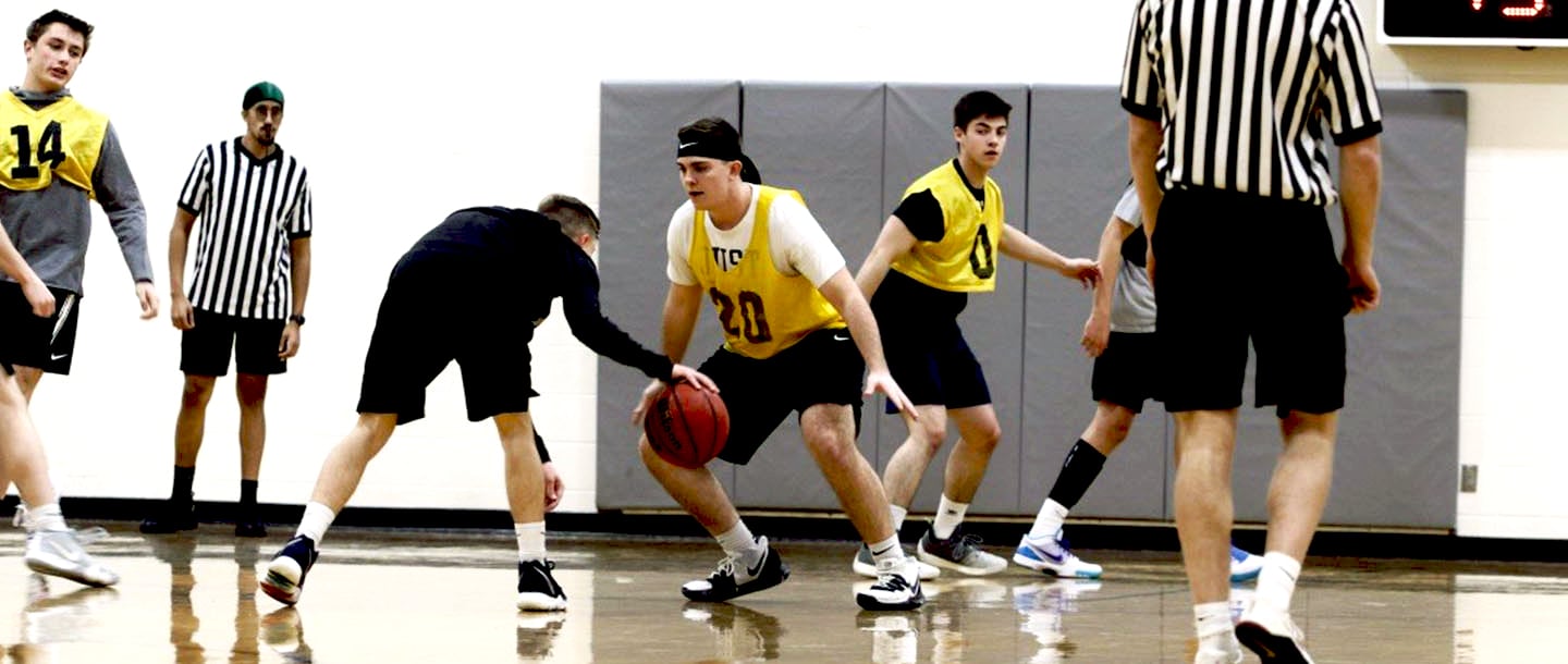 Men playing basketball in the Otto Recreation Center