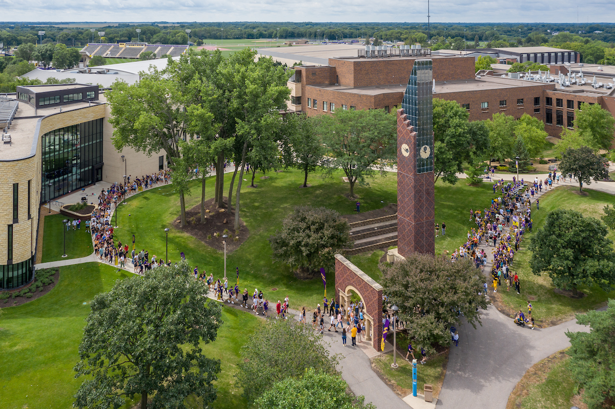 a group of people walking in a park