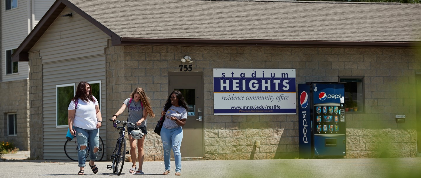 Girls walking outside in front of SH Office.jpg