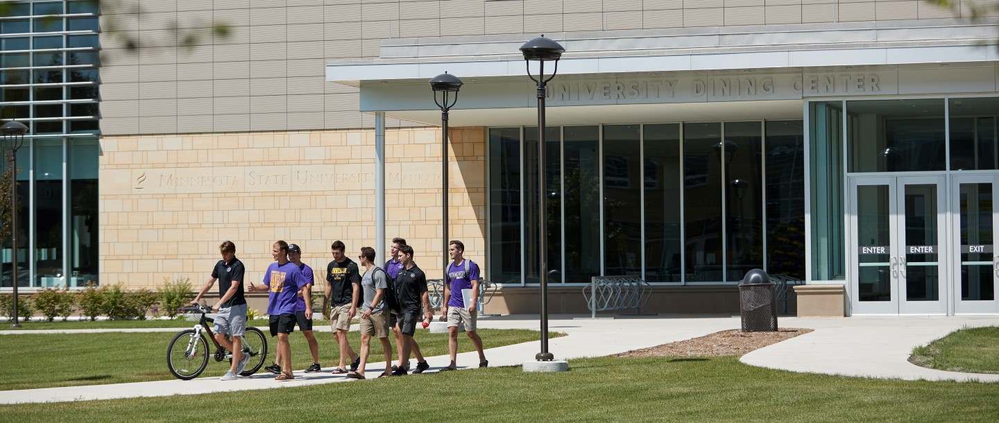 Hockey team walking in front of dining center