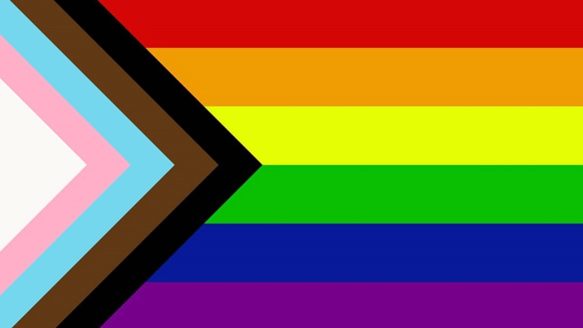a rainbow flag with a triangle