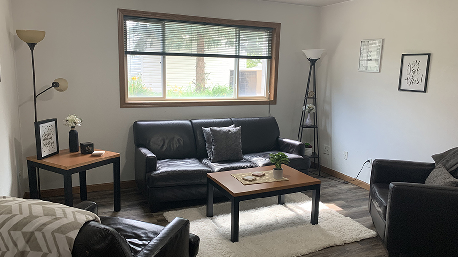 a living room with a couch and a table