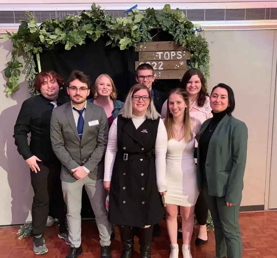 a group of people posing for a photo