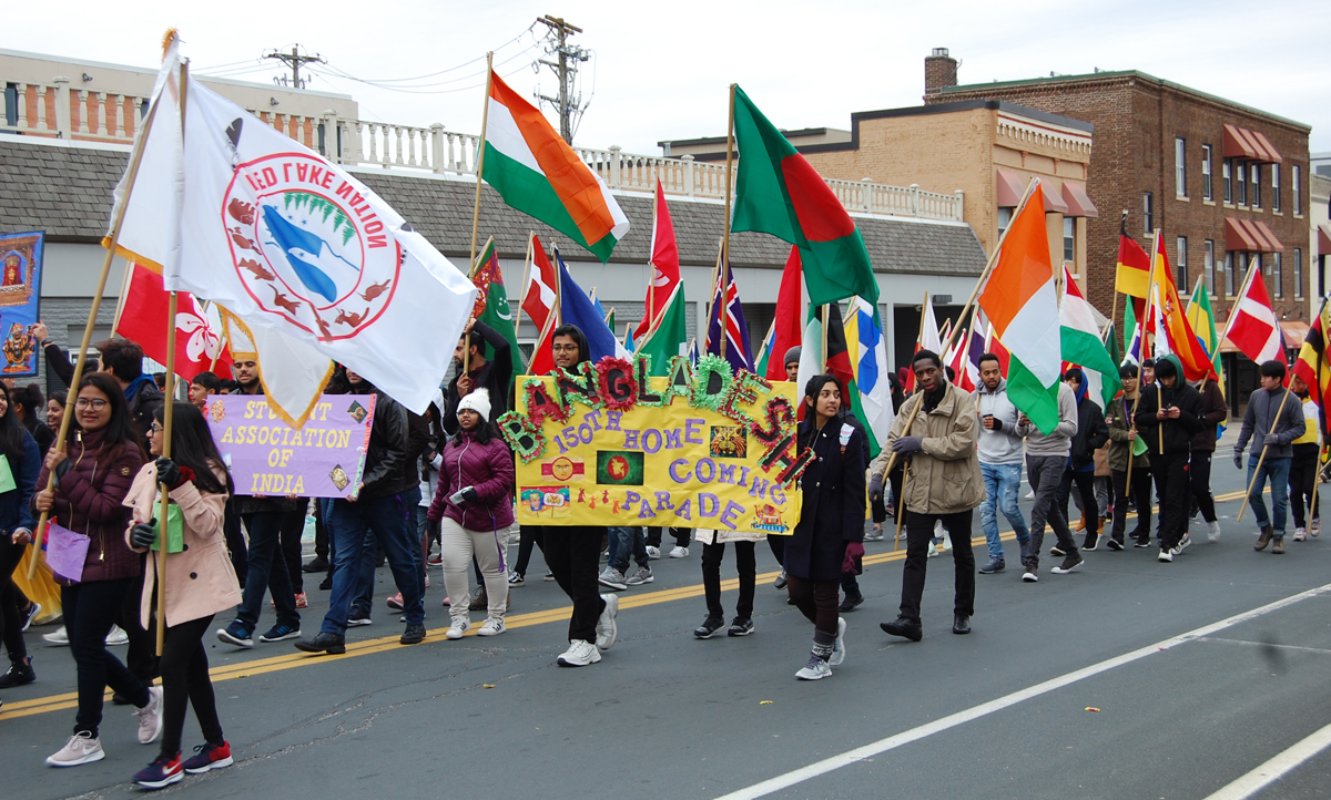 a group of people holding flags and banners