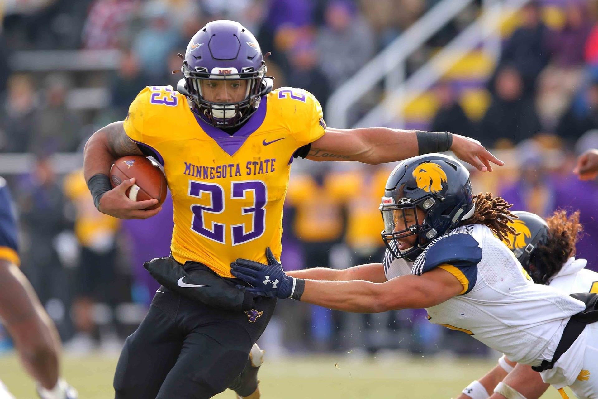 a football player running with the ball