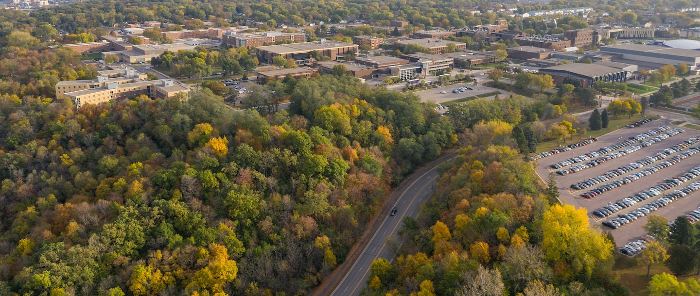 An aerial view of Minnesota State University Mankato from Stadium road hill on a fall evening