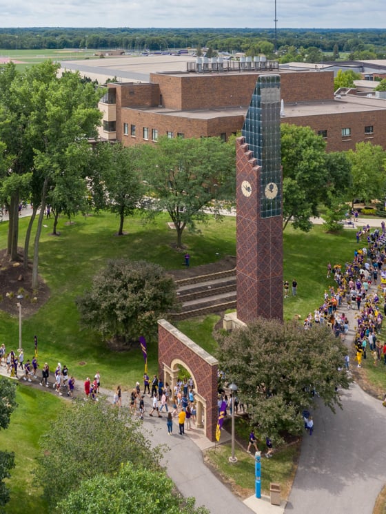 Aerial view of new Mavs walking through the Arch on Campus at the welcome event